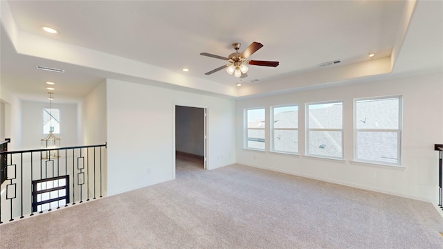 3916 Linear Dr, Celina, TX 75078 - empty room featuring ceiling fan, light colored carpet, and a tray ceiling