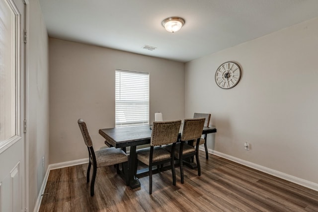 dining space featuring dark hardwood / wood-style flooring