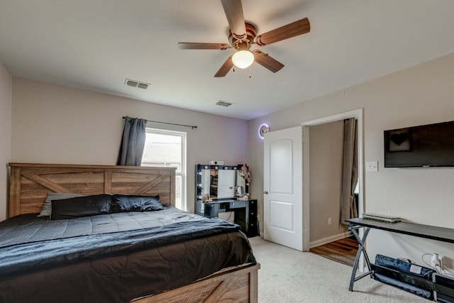 bedroom with light colored carpet and ceiling fan