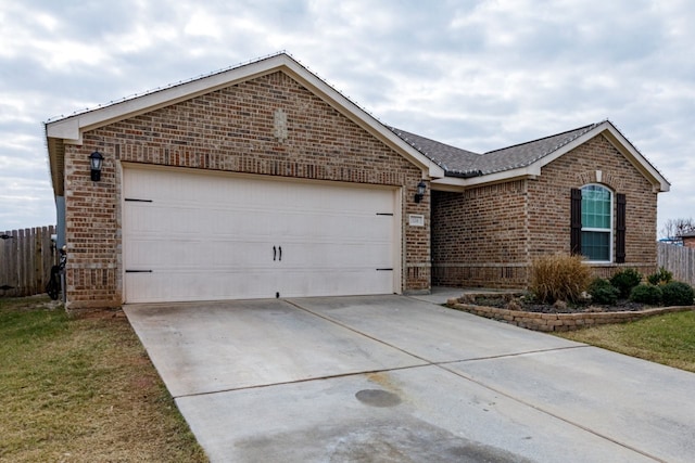 single story home with a garage