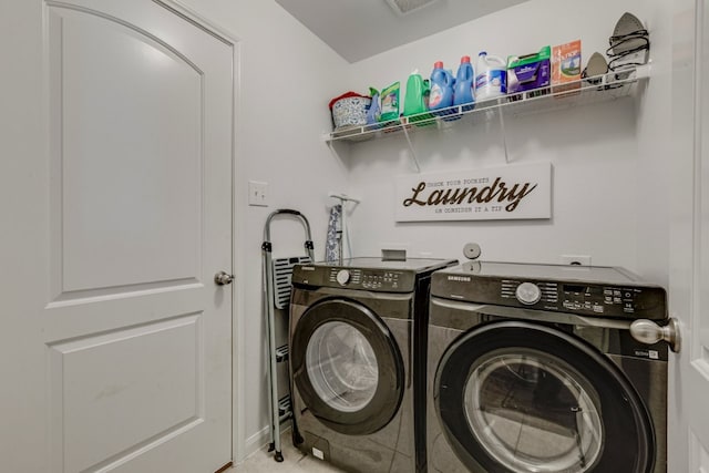 clothes washing area featuring independent washer and dryer