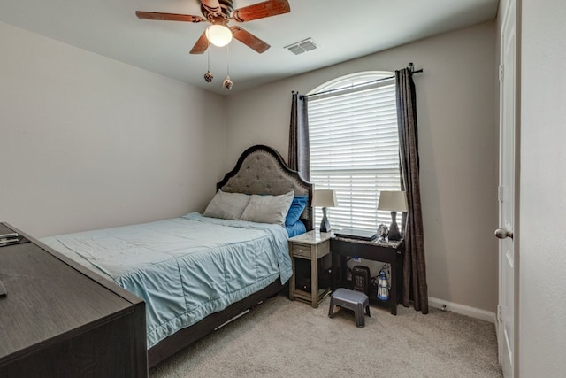 bedroom with ceiling fan and light colored carpet