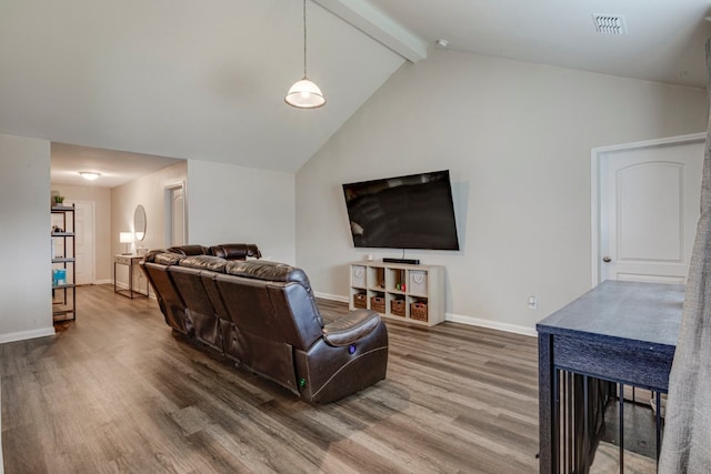 living room featuring beamed ceiling, wood-type flooring, and high vaulted ceiling