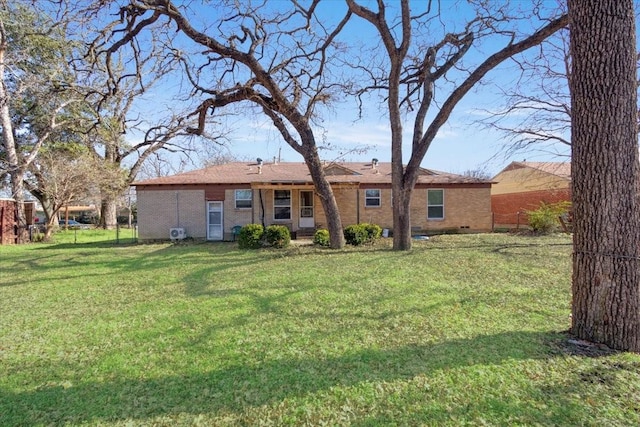 back of house with a yard