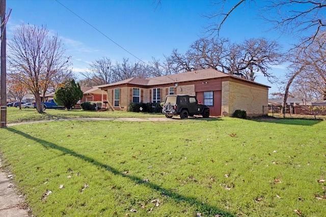 back of house featuring a lawn