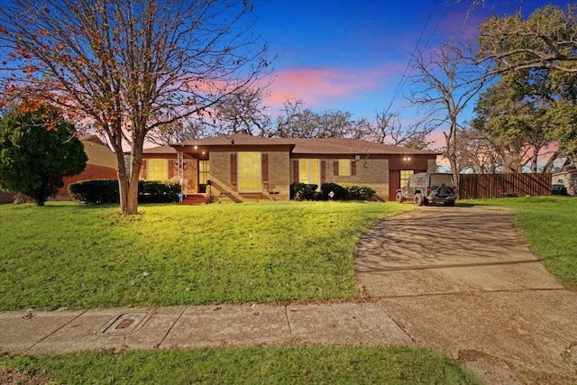 single story home featuring a yard