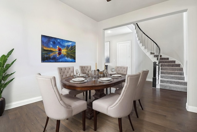 dining area with dark hardwood / wood-style flooring