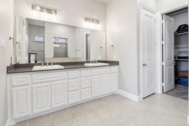 bathroom featuring tile patterned floors and vanity