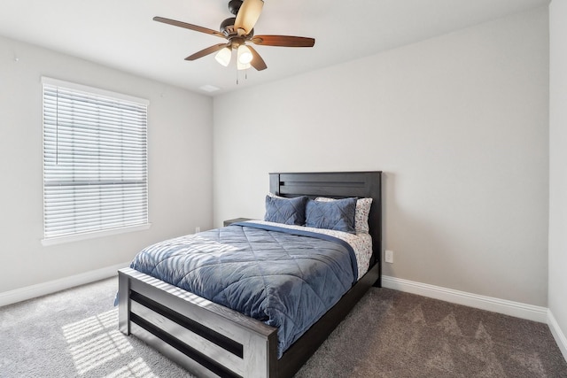 bedroom featuring ceiling fan and dark carpet