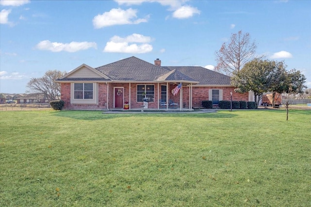 ranch-style house featuring a front lawn