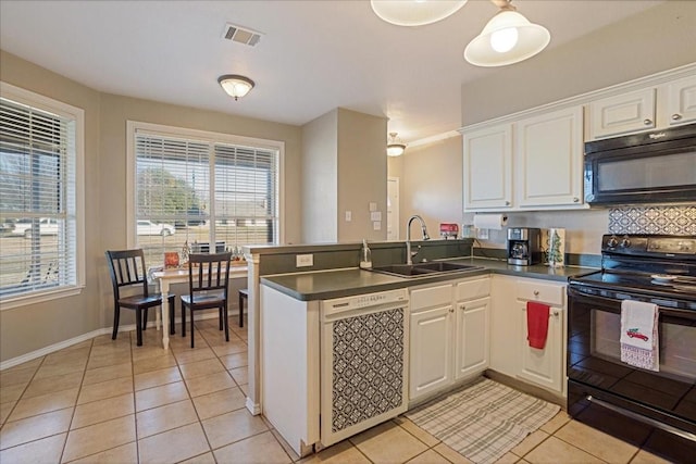 kitchen featuring sink, black appliances, kitchen peninsula, and white cabinets