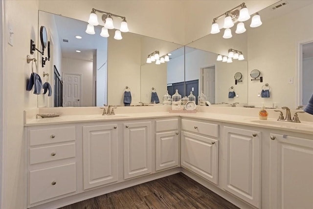 bathroom featuring vanity and wood-type flooring