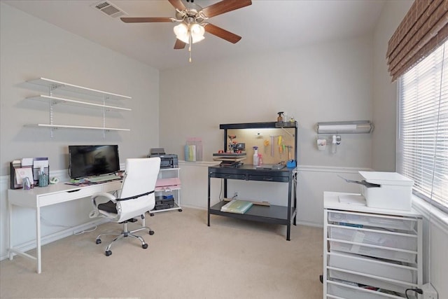 home office featuring light colored carpet and ceiling fan