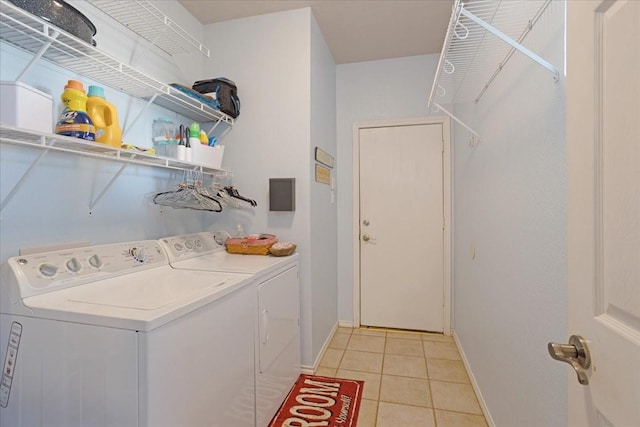 laundry area with light tile patterned floors and independent washer and dryer