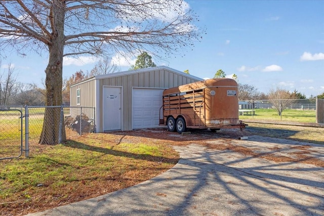 view of outbuilding featuring a yard and a garage