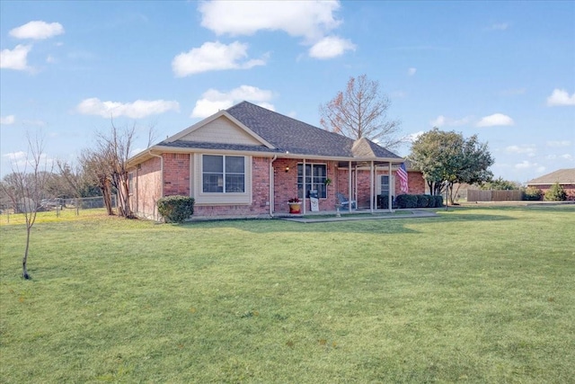 single story home with a front yard