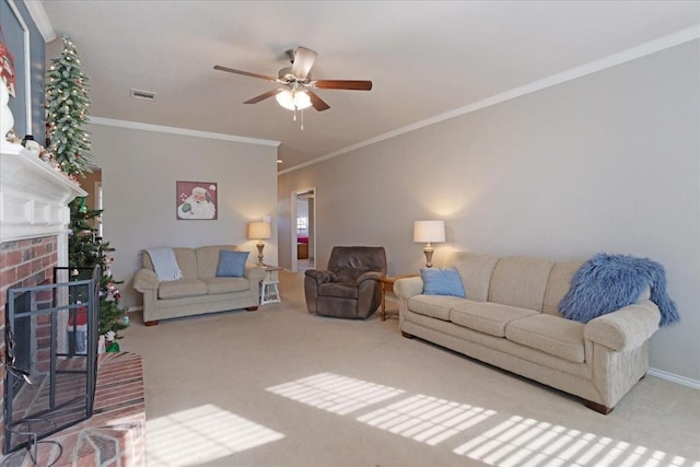 living room featuring ornamental molding, a brick fireplace, light colored carpet, and ceiling fan