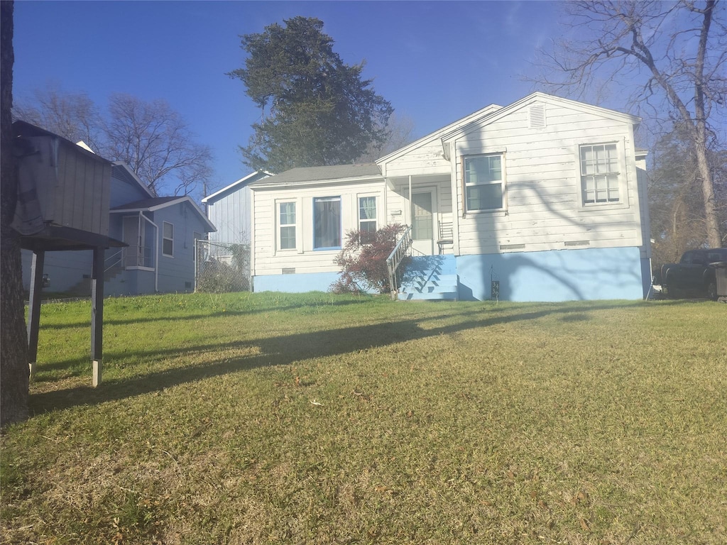 exterior space featuring a front lawn