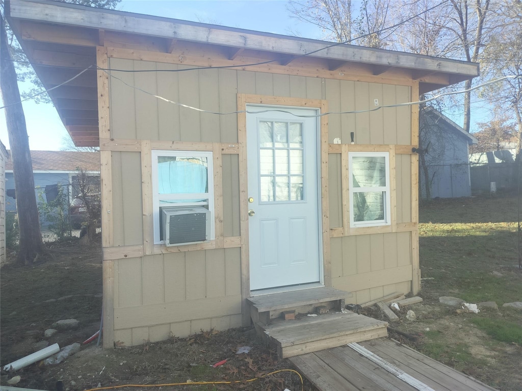 view of outbuilding featuring cooling unit