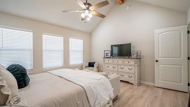 bedroom with ceiling fan, light hardwood / wood-style flooring, high vaulted ceiling, and beamed ceiling