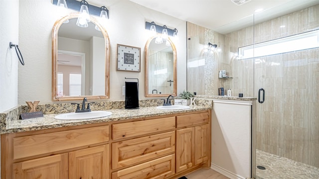 bathroom with vanity and an enclosed shower