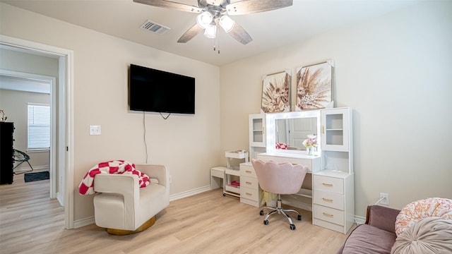 office space with light hardwood / wood-style flooring and ceiling fan