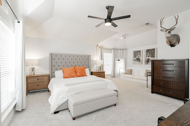 carpeted bedroom featuring ceiling fan and lofted ceiling