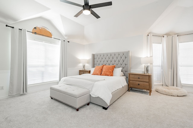 carpeted bedroom featuring ceiling fan and lofted ceiling