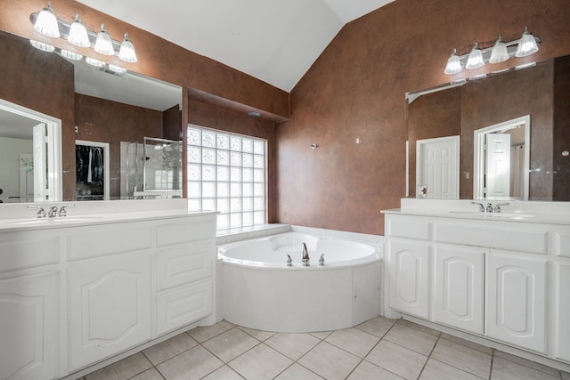 bathroom with tile patterned floors, vanity, lofted ceiling, and shower with separate bathtub