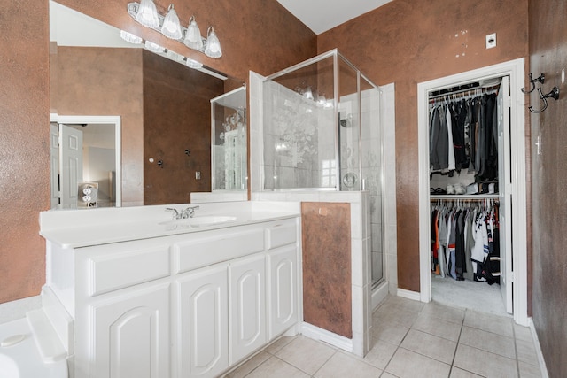 bathroom with vanity, tile patterned floors, and a shower with shower door