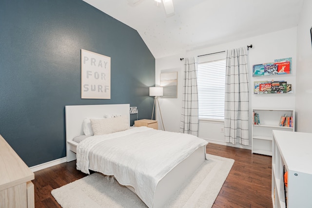 bedroom featuring dark hardwood / wood-style flooring, ceiling fan, and lofted ceiling