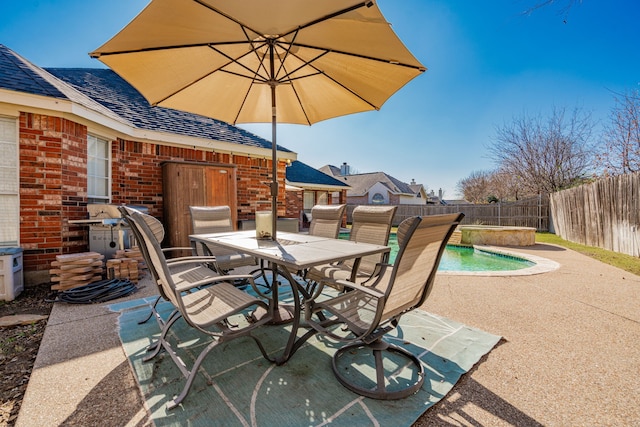 view of patio / terrace featuring a fenced in pool