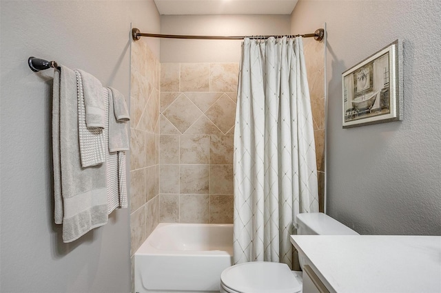 full bathroom featuring shower / bath combo, vanity, and toilet