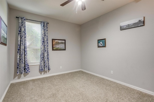 empty room featuring carpet and ceiling fan