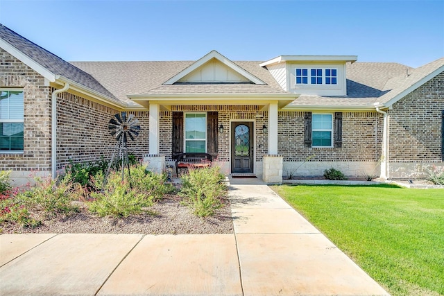 view of front of house with a front lawn and a porch