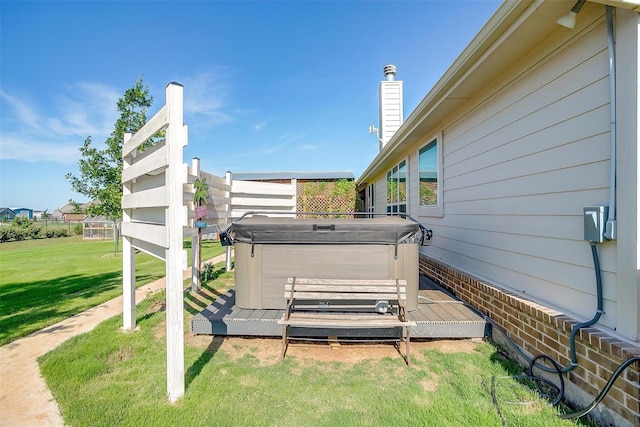 exterior space with a hot tub