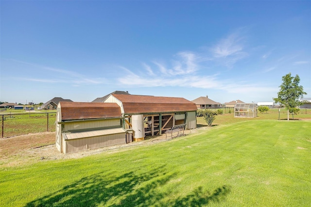 back of property with an outbuilding