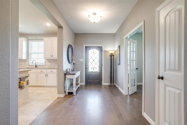 foyer featuring light hardwood / wood-style floors and sink