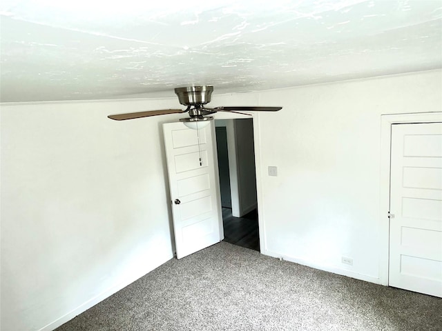 unfurnished bedroom featuring ceiling fan, carpet floors, and baseboards