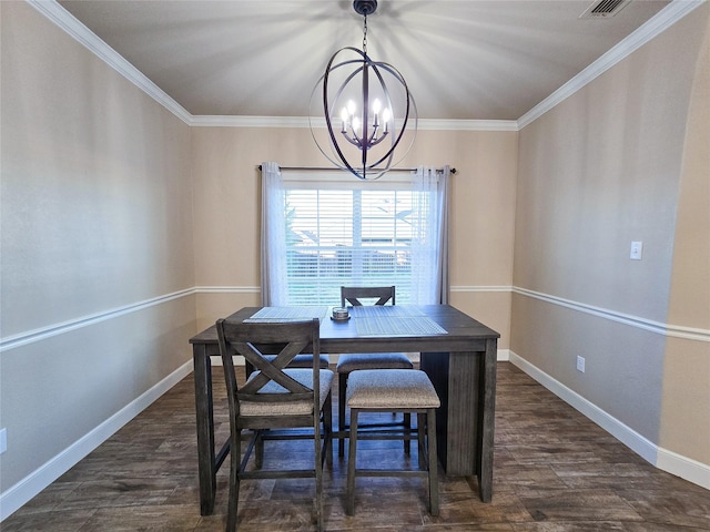 dining space featuring dark hardwood / wood-style floors, an inviting chandelier, and crown molding