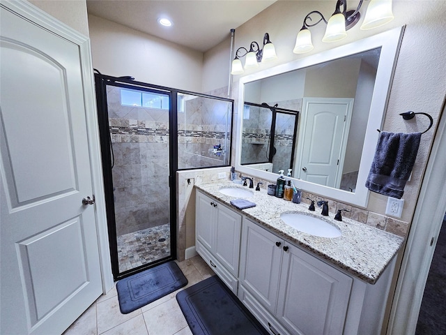 bathroom with vanity, tile patterned floors, and walk in shower