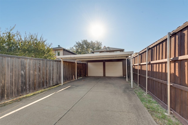 garage featuring a carport