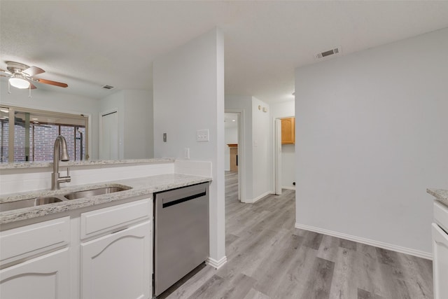 kitchen with sink, stainless steel dishwasher, ceiling fan, light hardwood / wood-style floors, and white cabinetry