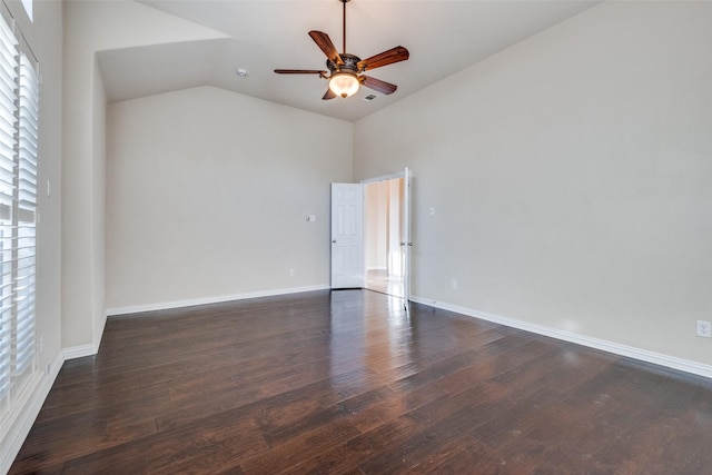 spare room with lofted ceiling, dark hardwood / wood-style floors, and ceiling fan