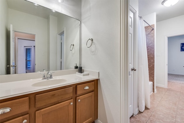 bathroom with vanity, tile patterned flooring, and shower / bath combo