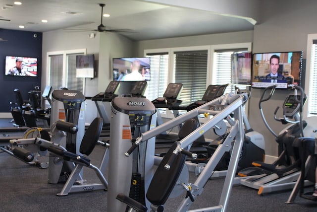 gym featuring ceiling fan and vaulted ceiling