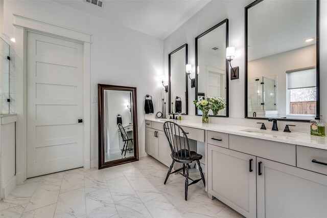 bathroom featuring vanity and an enclosed shower