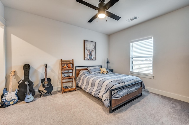 bedroom with ceiling fan and light carpet