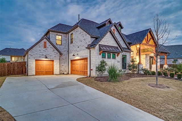 view of front of house featuring a front yard and a garage