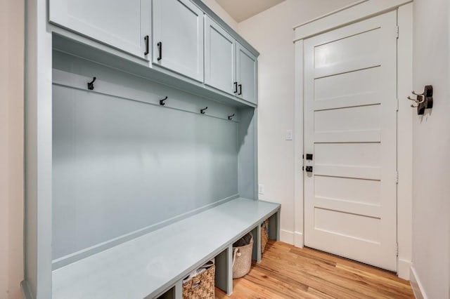 mudroom with light hardwood / wood-style floors